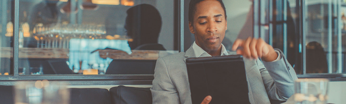 Man using tablet at restaurant