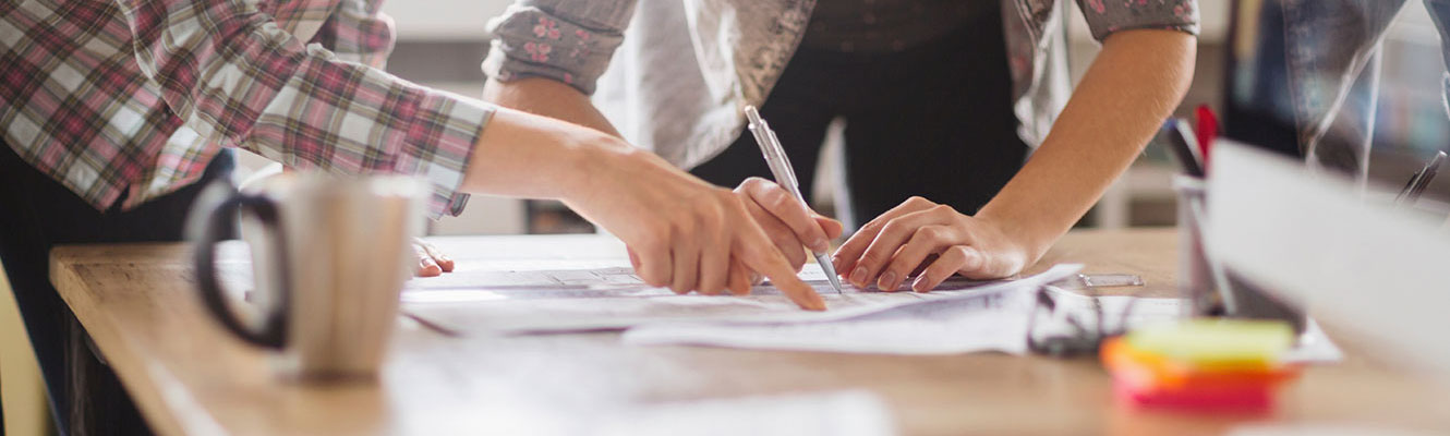 Two business women going over paperwork