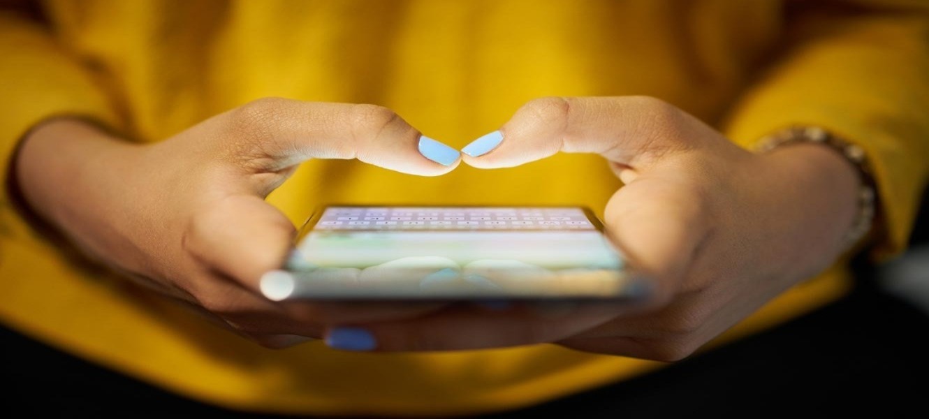 Close up of hands using phone