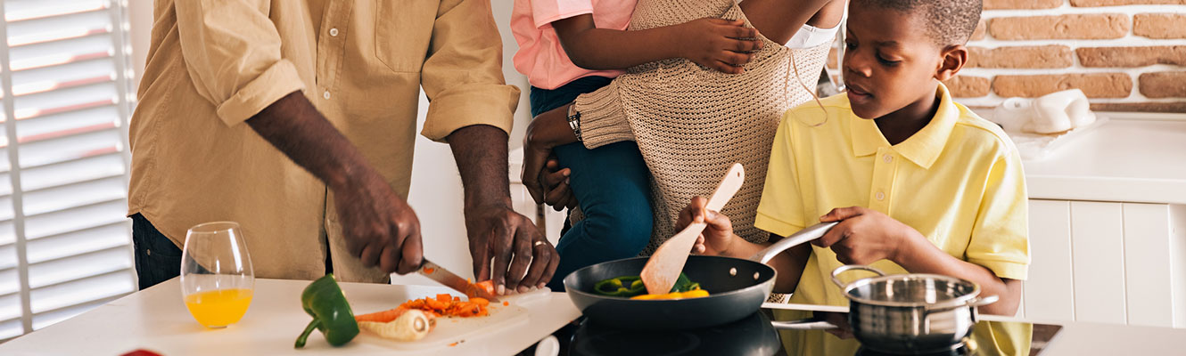 Family cooking in kitchen